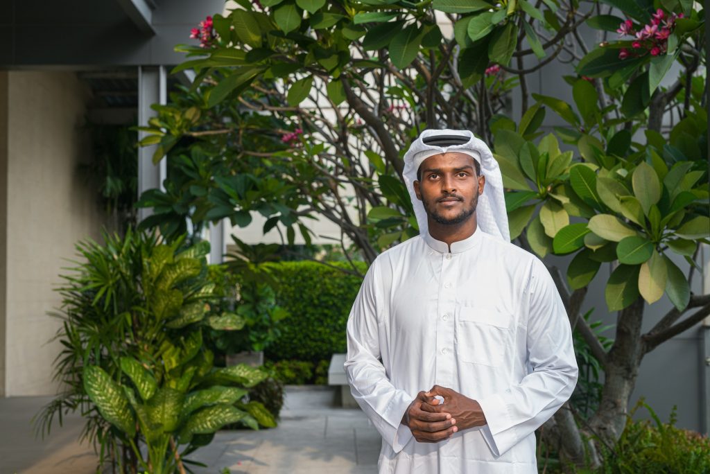 Portrait of African Muslim man wearing religious clothing an scarf at rooftop garden